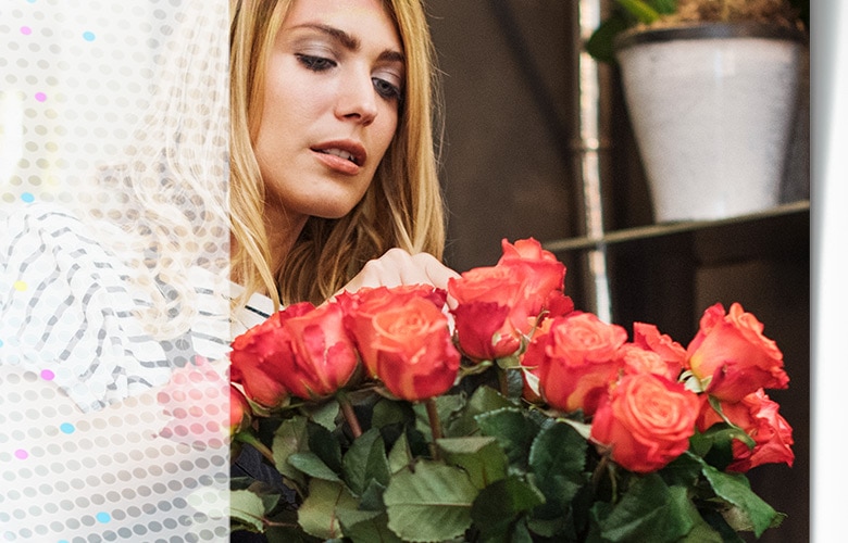 Woman holding bouquet of roses