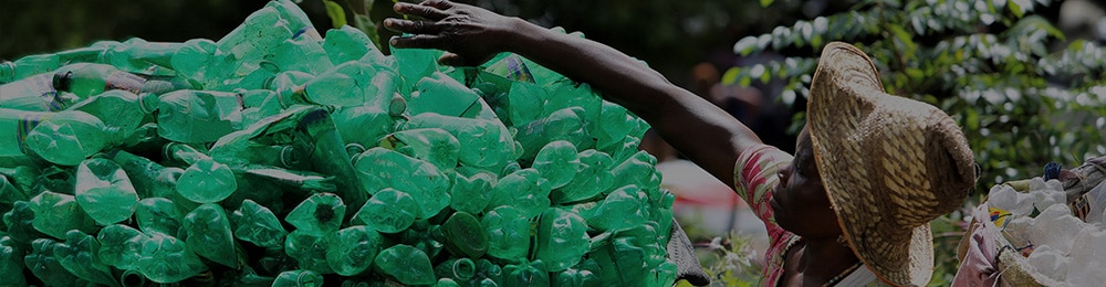 HP sustainability womand collecting plastic bottles